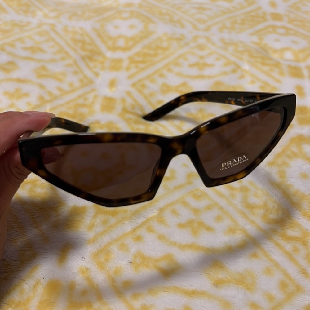 Prada tortoise print luxury glasses.